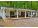 Relaxing covered porch with swing, seating, ceiling fans, and stylish decor at 7616 Nicholson Rd, Cumming, GA 30028