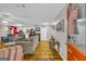 Cozy living room with hardwood floors, comfortable seating, and open access to the modern kitchen at 7616 Nicholson Rd, Cumming, GA 30028