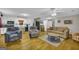 Open-concept living room flowing into a modern kitchen, perfect for entertaining guests at 7616 Nicholson Rd, Cumming, GA 30028