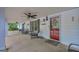 Relaxing front porch with seating, ceiling fans and charming decor at 7616 Nicholson Rd, Cumming, GA 30028