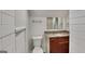 Bathroom with brown vanity, granite countertop, sink, toilet and subway tile shower at 321 Shadowbrooke Dr, Loganville, GA 30052