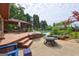 The backyard features a firepit and a large deck with outdoor seating and a swimming pool at 171 Wynn Dr, Hampton, GA 30228