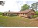 Expansive backyard with well-manicured lawn, brick home, and covered gazebo at 171 Wynn Dr, Hampton, GA 30228