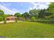 Expansive backyard featuring lush green lawn and landscaping, perfect for outdoor enjoyment at 171 Wynn Dr, Hampton, GA 30228