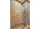 Bathroom with a bathtub, shower head, and grab bars, providing accessibility and convenience at 171 Wynn Dr, Hampton, GA 30228