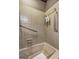 This bathroom showcases a shower/tub, grab bars, and tile surround at 171 Wynn Dr, Hampton, GA 30228