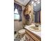 Classic bathroom featuring a vanity with a light countertop and a window at 171 Wynn Dr, Hampton, GA 30228