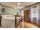 Comfortable bedroom boasts a wooden bed frame, ceiling fan, and bright natural light at 171 Wynn Dr, Hampton, GA 30228