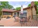 Outdoor deck featuring patio furniture and adjacent to the brick home at 171 Wynn Dr, Hampton, GA 30228