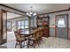 Charming dining room featuring a wooden table with chairs, a hutch, and a window for natural light at 171 Wynn Dr, Hampton, GA 30228