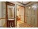 Inviting foyer with vintage mirror, patterned tile, and warm wood trim at 171 Wynn Dr, Hampton, GA 30228