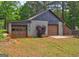 Two car garage with two bays on a rural property at 171 Wynn Dr, Hampton, GA 30228