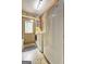 Convenient laundry room with washer, dryer, and an exterior door with a window at 171 Wynn Dr, Hampton, GA 30228