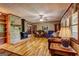 Spacious living room with a brick fireplace and views into another room at 171 Wynn Dr, Hampton, GA 30228