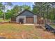 Outbuilding with multiple bays for equipment and storage on a rural lot at 171 Wynn Dr, Hampton, GA 30228