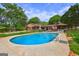In-ground swimming pool surrounded by well manicured landscaping and a fenced in yard at 171 Wynn Dr, Hampton, GA 30228