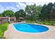 Backyard swimming pool with a surrounding deck, gazebo and fenced perimeter at 171 Wynn Dr, Hampton, GA 30228