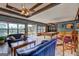 Spacious recreation room featuring a pool table, bar seating, and comfortable seating at 171 Wynn Dr, Hampton, GA 30228