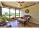 Bright sunroom featuring lots of windows and inviting furniture, perfect for enjoying the outdoor view at 171 Wynn Dr, Hampton, GA 30228