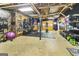 Unfinished basement space converted to a home gym with exercise equipment and storage at 139 Crown Forest Dr, Mcdonough, GA 30252