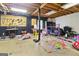 Unfinished basement with exposed ceiling and various tools, gym equipment, and toys at 139 Crown Forest Dr, Mcdonough, GA 30252