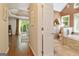 View from the bedroom doorway of the bathroom with a soaking tub and shower at 139 Crown Forest Dr, Mcdonough, GA 30252