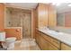 Bathroom featuring a walk-in shower with tile surround, vanity, and toilet at 139 Crown Forest Dr, Mcdonough, GA 30252
