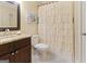 Bathroom featuring a vanity with granite top, toilet, and a shower with a curtain at 139 Crown Forest Dr, Mcdonough, GA 30252