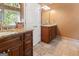 Bathroom features a granite countertop, a double vanity with wood cabinets, and tile flooring at 139 Crown Forest Dr, Mcdonough, GA 30252