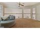 Open bonus room with neutral walls, carpet flooring, and a window overlooking the living space at 139 Crown Forest Dr, Mcdonough, GA 30252