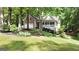 Charming home with a brick and siding facade, covered porch, and manicured lawn at 139 Crown Forest Dr, Mcdonough, GA 30252