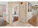 View of the hallway with three rooms branching off; showing tile and hardwood floors at 139 Crown Forest Dr, Mcdonough, GA 30252