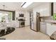 Updated kitchen featuring stainless steel appliances, light cabinetry, and modern fixtures at 139 Crown Forest Dr, Mcdonough, GA 30252