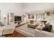 Spacious living room featuring comfortable seating, modern decor, and hardwood flooring at 139 Crown Forest Dr, Mcdonough, GA 30252