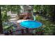 An above-ground pool with slide and a large deck create an oasis in the backyard of this charming home at 139 Crown Forest Dr, Mcdonough, GA 30252