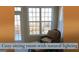 Cozy sitting room bathed in natural light, showcasing a comfortable chair and scenic outdoor view at 30 Cynthia Ct, Fayetteville, GA 30215