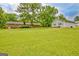 Expansive backyard featuring lush green lawn, mature trees, and detached garage at 110 Silver Leaf Dr, Fayetteville, GA 30214