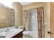 Cozy bathroom with a combination tub and shower, a toilet, and sink with a mirror at 110 Silver Leaf Dr, Fayetteville, GA 30214