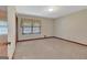 Bedroom with neutral carpeting, a window with curtains, and an overhead ceiling light at 110 Silver Leaf Dr, Fayetteville, GA 30214