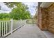 Spacious wooden deck with white railing providing relaxing outdoor space with mature tree views at 110 Silver Leaf Dr, Fayetteville, GA 30214