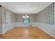 Dining room features wallpaper, wood floors, and a traditional chandelier at 110 Silver Leaf Dr, Fayetteville, GA 30214