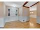 The entryway features hardwood floors and traditional wainscoting at 110 Silver Leaf Dr, Fayetteville, GA 30214