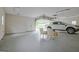 Open garage door with parked pickup truck and chairs inside garage with lighting at 110 Silver Leaf Dr, Fayetteville, GA 30214