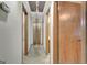 Hallway featuring overhead lighting, doors, and beige carpeting at 110 Silver Leaf Dr, Fayetteville, GA 30214