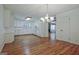 Open kitchen with white cabinets and hardwood floors, offering ample space at 110 Silver Leaf Dr, Fayetteville, GA 30214