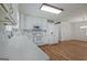 Bright kitchen features white cabinets, modern appliances, and hardwood floors at 110 Silver Leaf Dr, Fayetteville, GA 30214
