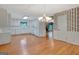 Open-concept kitchen area with white cabinets and hardwood floors at 110 Silver Leaf Dr, Fayetteville, GA 30214