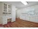 Functional kitchen with white cabinetry, hardwood floors, and a built-in desk area at 110 Silver Leaf Dr, Fayetteville, GA 30214