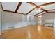 Large living room with hardwood floors, a beamed ceiling, and neutral paint at 110 Silver Leaf Dr, Fayetteville, GA 30214