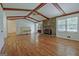 Expansive living room boasts hardwood floors, vaulted ceiling, and a stone fireplace at 110 Silver Leaf Dr, Fayetteville, GA 30214